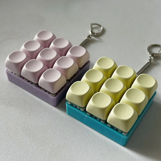 2-Pack Light Pink Mechanical 9-Keyboard Fingertip Toy Keychain - Key Pressure Relief, PVC Fingertip Toy - Mekamart Australia