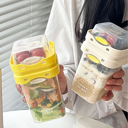 Yellow Portable salad cup with ingredient compartment and fork and spoon - enjoy breakfast on the go